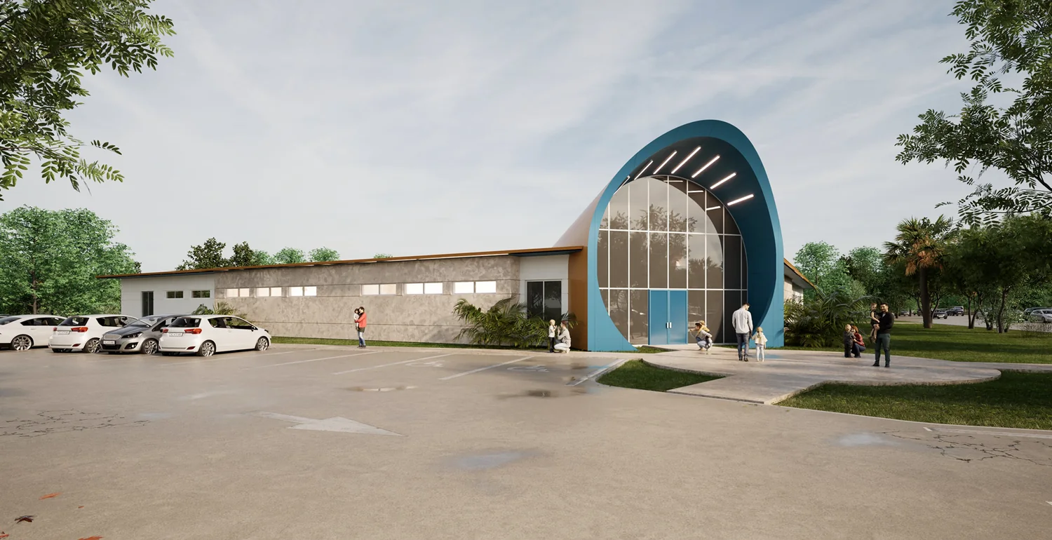 Front of Atlas Early Learning Center: a curved blue arched entrance with tall glass doors, parking area and palm trees